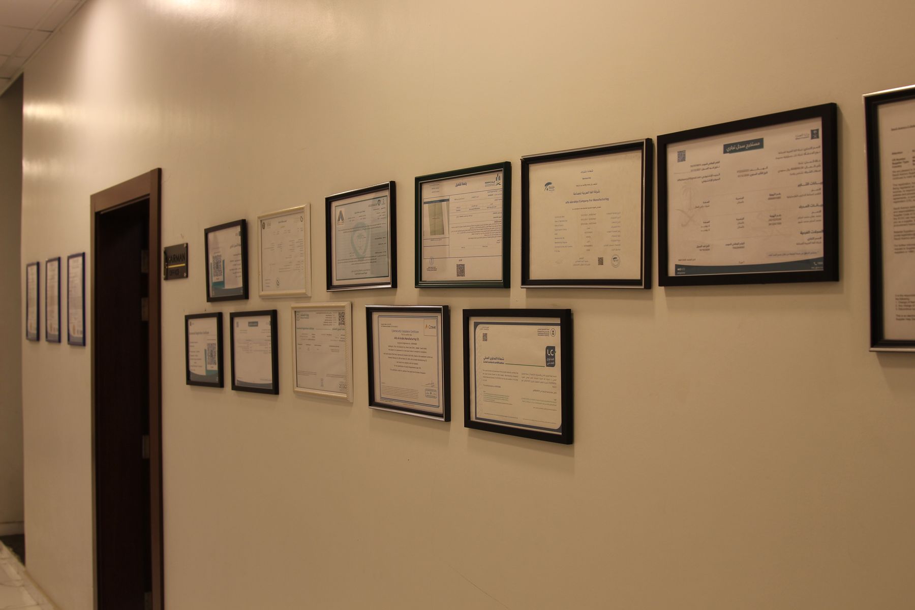Framed certifications and licenses on display
